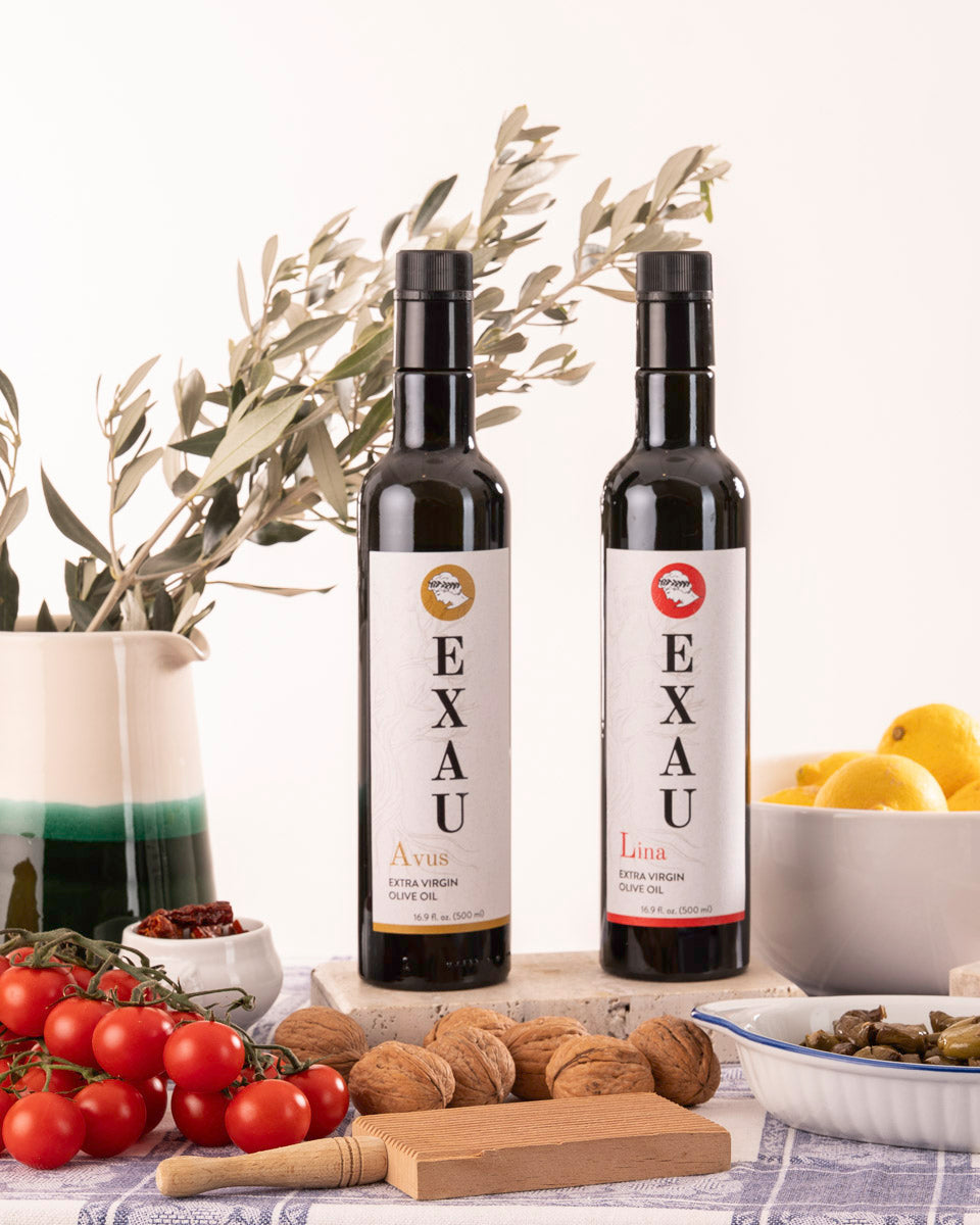 Two bottles of EXAU extra virgin olive oil. One Avus. One Lina.